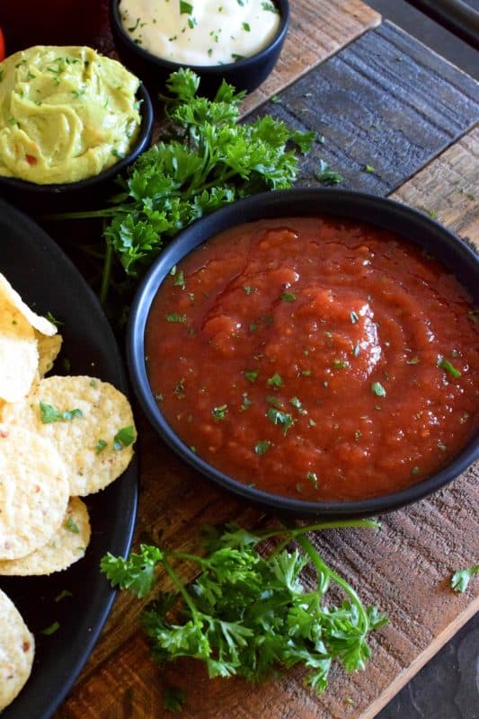 Unlike store-bought chunky salsa, Restaurant Style Canned Tomato Salsa, sometimes called Blender Salsa, is a smooth condiment that lends itself to more than just a dip for chips! #salsa #blender #canning #restaurant #style #smooth #homemade