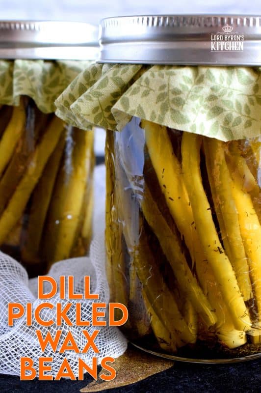 Dill Pickled Wax Beans are super dilly with a hint of salty and peppery flavour. Stock your pantry full of these for a great side dish ready to go at any time. These are perfect on a cheese board or wrapped with thinly sliced hot salami! #pickled #preserved #canning #waxbeans #dillpickle