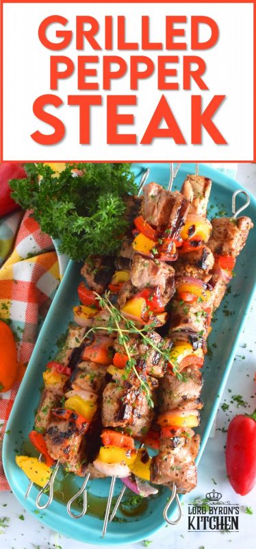 Marinated and skewered, Grilled Pepper Steak is simple, yet so delicious! The marinade tenderizes the steak while the peppers and red onions help to flavour it. Perfectly prepared to medium-well in about twelve minutes! #steak #bbq #kebabs #skewers #beef #summergrilling #grilled