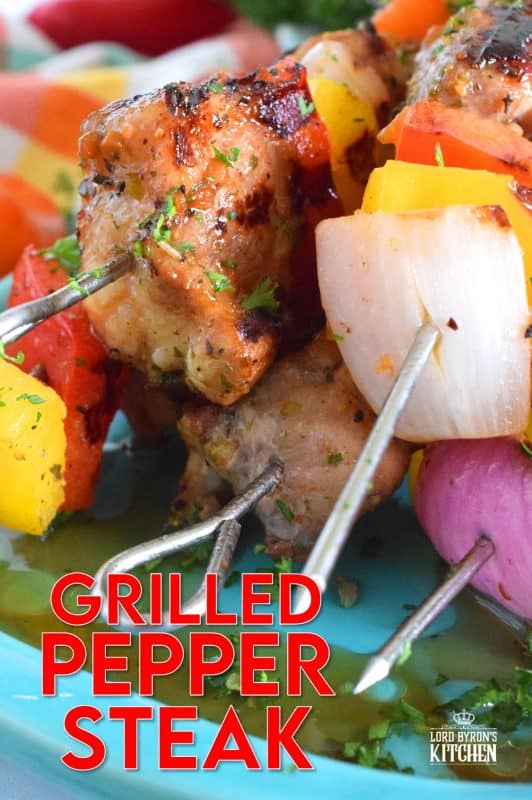 Marinated and skewered, Grilled Pepper Steak is simple, yet so delicious! The marinade tenderizes the steak while the peppers and red onions help to flavour it. Perfectly prepared to medium-well in about twelve minutes! #steak #bbq #kebabs #skewers #beef #summergrilling #grilled