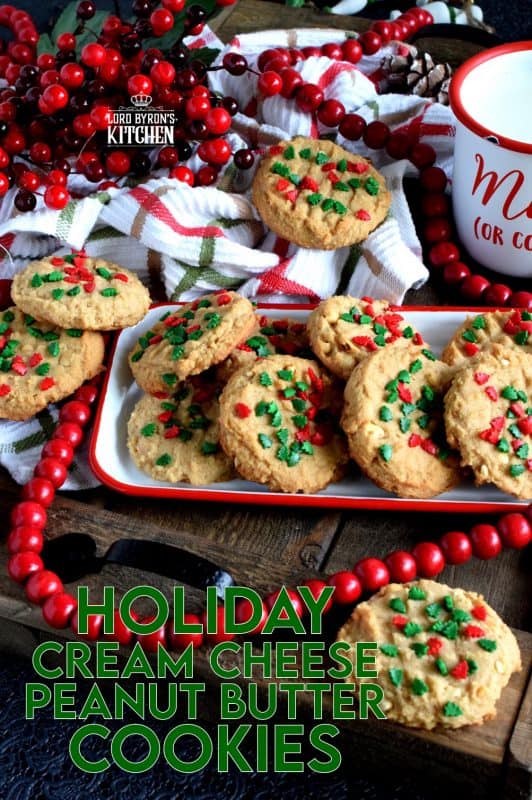 Nostalgia gets an update with these Holiday Cream Cheese Peanut Butter Cookies. Take a classic peanut butter cookie and add cream cheese to get a lighter, flakier, tastier update on your favourite childhood cookie. Don't worry, the cream cheese does not take away any of that delicious peanut butter flavour! #holiday #christmas #baking #peanutbutter #creamcheese #cookies #sprinkles