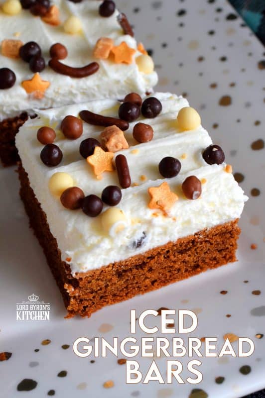 Soft, moist, and fudge-like; these Iced Gingerbread Bars taste like the familiar flavours of Christmas, but have the texture of a dense, chocolaty brownie. #christmas #holiday #baking #gingerbread #bars #squares #cookies