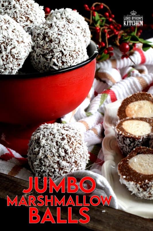 A popular Christmastime treat in Newfoundland, Jumbo Marshmallow Balls are cookies that make you feel as though you were eating candy. Serve whole or sliced, but best when frozen! A thick coconut and chocolate mixture is formed around a jumbo marshmallow and rolled in more coconut. This is one serious cookie! #newfoundland #traditional #jumbo #chocolate #marshmallow #balls #christmas #nobake #holiday