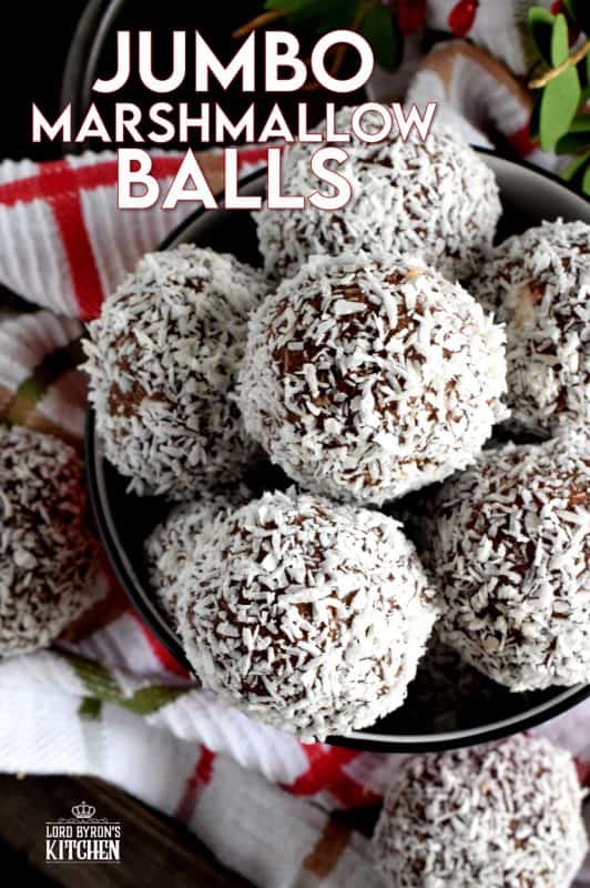 A popular Christmastime treat in Newfoundland, Jumbo Marshmallow Balls are cookies that make you feel as though you were eating candy. Serve whole or sliced, but best when frozen! A thick coconut and chocolate mixture is formed around a jumbo marshmallow and rolled in more coconut. This is one serious cookie! #newfoundland #traditional #jumbo #chocolate #marshmallow #balls #christmas #nobake #holiday