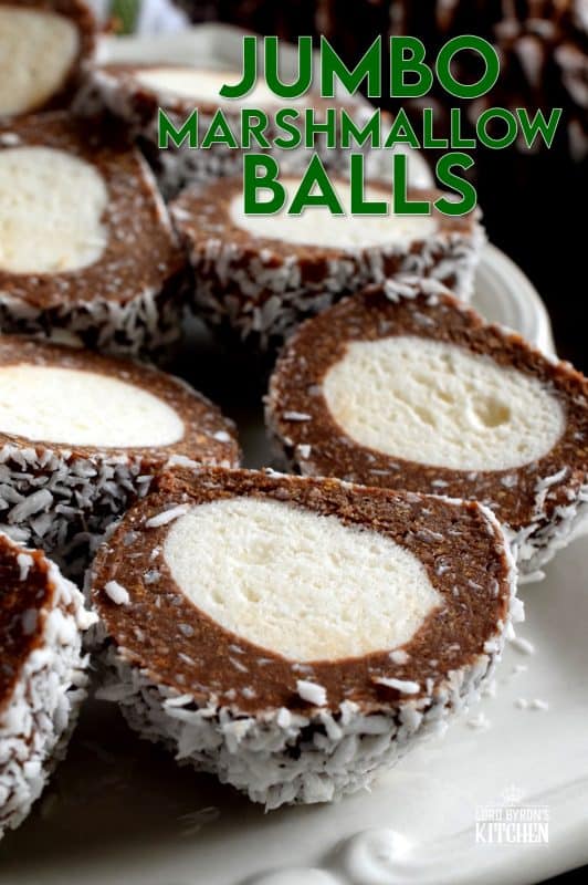 A popular Christmastime treat in Newfoundland, Jumbo Marshmallow Balls are cookies that make you feel as though you were eating candy. Serve whole or sliced, but best when frozen! A thick coconut and chocolate mixture is formed around a jumbo marshmallow and rolled in more coconut. This is one serious cookie! #newfoundland #traditional #jumbo #chocolate #marshmallow #balls #christmas #nobake #holiday