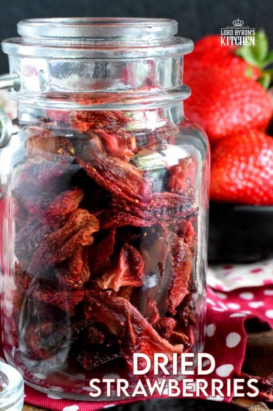 Strawberry season is short. Make the season last with Oven Dried Strawberries that you can use for months to come. Add these to cereal, granola, scones, or salads! #dried #dehydrated #oven #strawberries #strawberry