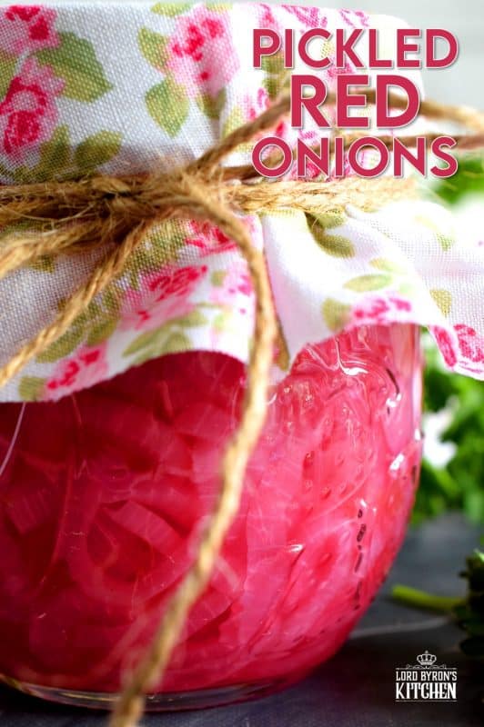 Pickled Red Onions are not only gorgeous to look at, they are delightfully tasty as well! Bright and crisp, a great addition to almost anything, and super easy to make; you'll want to keep a jar in your fridge at all times! #pickled #redonions #red #onions #preserved
