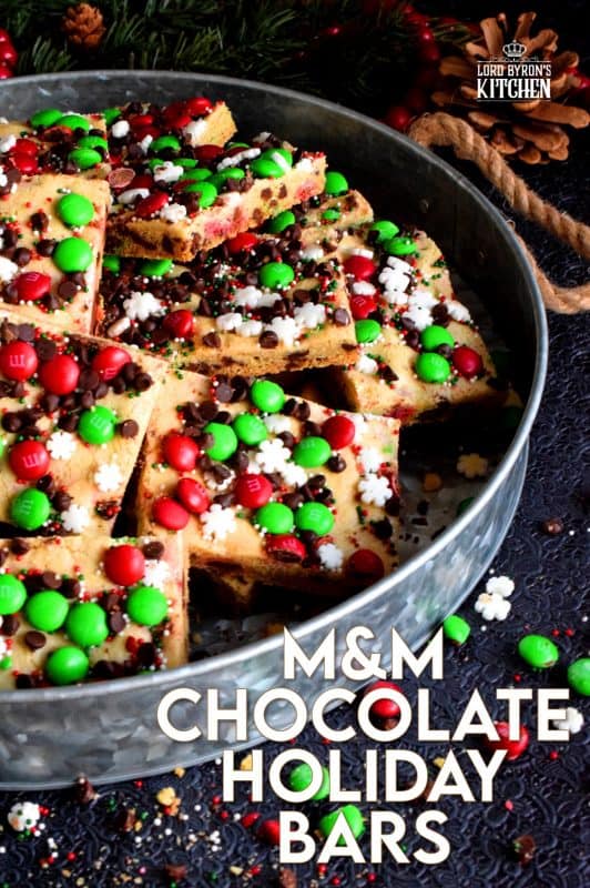 Fast, simple, and easy – just the way Christmas baking should be! Sheet Pan M&M Chocolate Holiday Bars are festive, fun, and family-friendly! Baking cookies in a sheet pan like this, is much faster than baking one tray at a time! #christmas #holiday #baking #cookies #candy #m&m #sheetpan