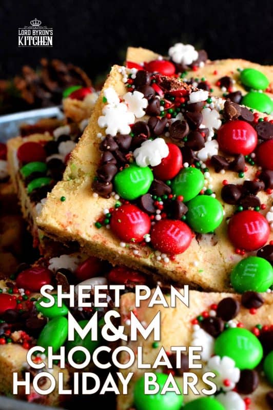 Fast, simple, and easy – just the way Christmas baking should be! Sheet Pan M&M Chocolate Holiday Bars are festive, fun, and family-friendly! Baking cookies in a sheet pan like this, is much faster than baking one tray at a time! #christmas #holiday #baking #cookies #candy #m&m #sheetpan