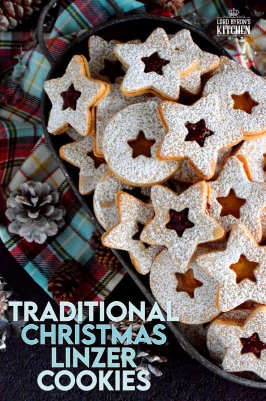 Christmas is all about tradition, both the new traditions and the old. This Traditional Christmas Linzer Cookies recipe, an old world cookie confection, originating in Austria, is a vital part of holiday traditions for many families. Also, they look impressive, but they are so simple to make! #linzer #traditional #christmas #holiday #baking #cookies