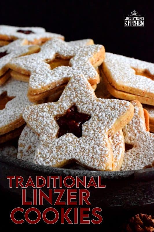 Christmas is all about tradition, both the new traditions and the old. This Traditional Christmas Linzer Cookies recipe, an old world cookie confection, originating in Austria, is a vital part of holiday traditions for many families. Also, they look impressive, but they are so simple to make! #linzer #traditional #christmas #holiday #baking #cookies
