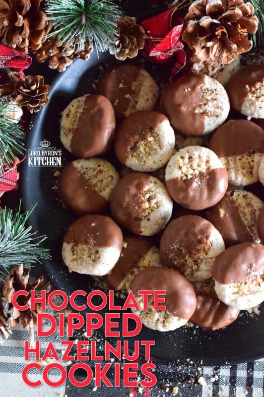 Ground hazelnuts, butter, sugar, and chocolate - what more is there to say? Chocolate Dipped Hazelnut Cookies have deep nutty flavour, a great texture, and bit of indulgence. One batch will never do! #chocolatedipped #hazenut #nut #chocolate #cookies #christmas #holiday #baking