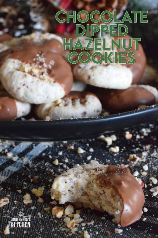 Ground hazelnuts, butter, sugar, and chocolate - what more is there to say? Chocolate Dipped Hazelnut Cookies have deep nutty flavour, a great texture, and bit of indulgence. One batch will never do! #chocolatedipped #hazenut #nut #chocolate #cookies #christmas #holiday #baking