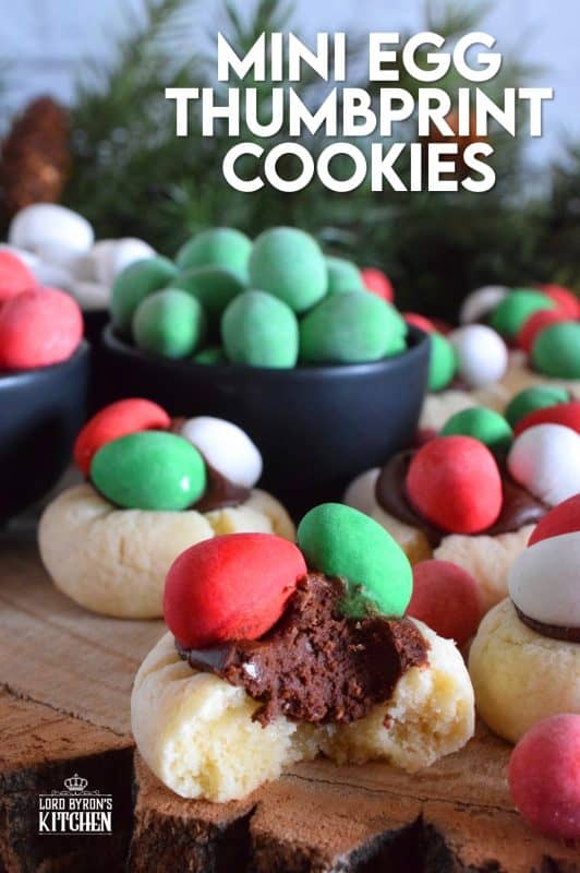 These are made using a classic thumbprint cookie dough, which is stuffed with a creamy chocolate frosting, and topped with mini eggs. There's no doubt that Christmas Mini Egg Thumbprint Cookies will be the first cookie to disappear from your cookie platter! #minieggs #cadbury #hershey #christmas #holiday #baking #thumbprint #cookies