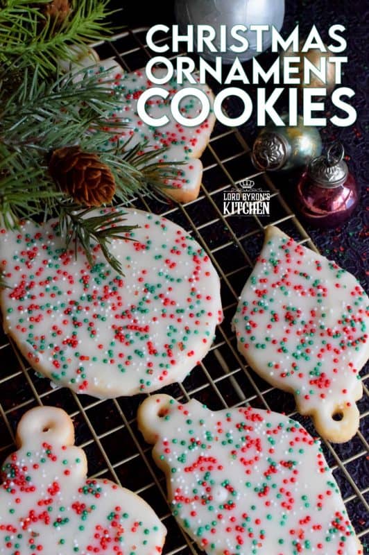 These Christmas Tree Ornament Cookies are adorably cute as a decoration on a tree, but even better packaged for friends and neighbours! Don't be fooled by how cute these are, they are not complicated at all. Baking these is a great way to spend a snowy afternoon! #christmas #tree #ornament #homemade #baked #edible #cookies #holiday #baking