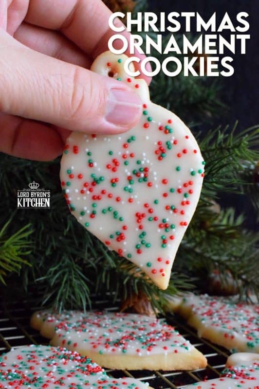 These Christmas Tree Ornament Cookies are adorably cute as a decoration on a tree, but even better packaged for friends and neighbours! Don't be fooled by how cute these are, they are not complicated at all. Baking these is a great way to spend a snowy afternoon! #christmas #tree #ornament #homemade #baked #edible #cookies #holiday #baking