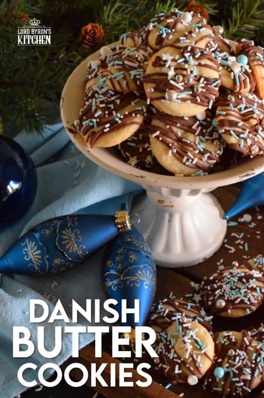 Melt in your mouth Danish Butter Cookies taste just like those cookies in the blue tin at your grandma's house. These are drizzled with milk chocolate, because everything at Christmastime should be over the top! #danish #butter #cookies #christmas #holiday #baking #dansk