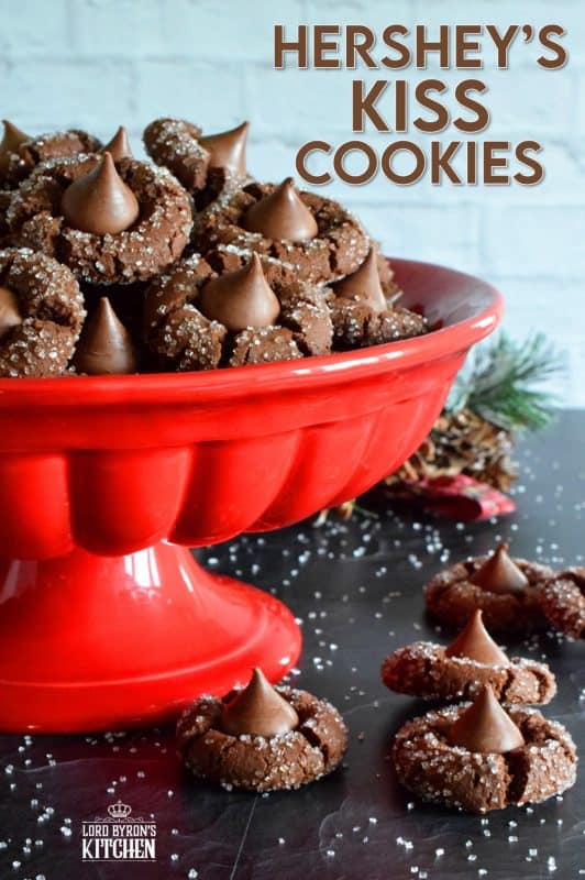 A deliciously decadent chocolate cookie, coated in sugar, and topped with a chocolate kiss, Hershey's Kiss Cookies are a perfect holiday treat that everyone will love! Want my advice? Make a lot of these, because they will disappear quite quickly! #hersheys #kiss #cookies #christmas #holiday #baking