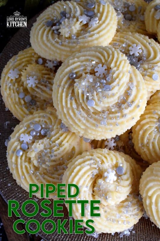 There are no special skills needed to make these gorgeous Holiday Piped Rosette Cookies; they're very impressive, but they're also very easy! These pack well and are great for storing in tins for gift giving!! #rosette #piped #cookies #christmas #holiday #baking