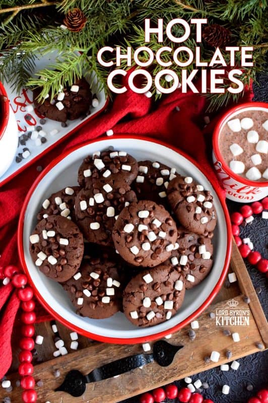 Hot Chocolate Cookies are slightly crispy on the outside, with a moist and dense chocolaty center; complete with mini marshmallow bits! These are substantial cookies, meaning that they are thick and filling. Great for dunking in hot chocolate too! #hotchocolate #hot #chocolate #cookies #marshmallow #bits