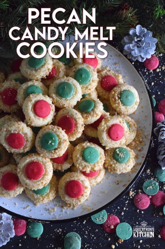 Loaded with chopped pecans, these Pecan Candy Melt Cookies are prepared with cream cheese and topped with a single candy melt. A soft, nutty cookie with just the right amount of sweetness; and cute too! Who says thumbprint cookies must have jam!? #pecan #candymelts #wilton #cookies #christmas #holiday #baking