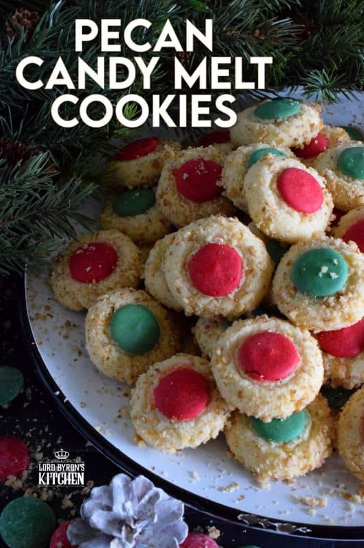 Loaded with chopped pecans, these Pecan Candy Melt Cookies are prepared with cream cheese and topped with a single candy melt. A soft, nutty cookie with just the right amount of sweetness; and cute too! Who says thumbprint cookies must have jam!? #pecan #candymelts #wilton #cookies #christmas #holiday #baking