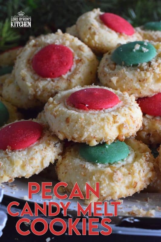 Loaded with chopped pecans, these Pecan Candy Melt Cookies are prepared with cream cheese and topped with a single candy melt. A soft, nutty cookie with just the right amount of sweetness; and cute too! Who says thumbprint cookies must have jam!? #pecan #candymelts #wilton #cookies #christmas #holiday #baking