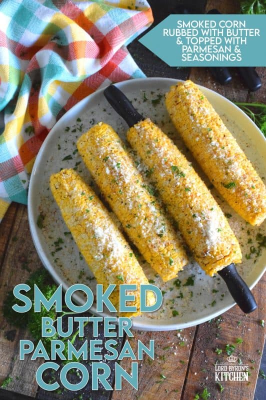 Something magical happens to food prepared in a smoker that cannot be replicated with any other cooking device. Smoked Butter Parmesan Corn is evidence of that! Fresh corn is slow smoked with apple wood and coated with melted butter, grated parmesan, black pepper, and an optional dusting of cayenne! #smoker #smokingrecipes #corn #cornonthecob #backyardsmoking #charcoal
