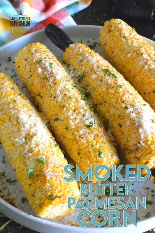 Something magical happens to food prepared in a smoker that cannot be replicated with any other cooking device. Smoked Butter Parmesan Corn is evidence of that! Fresh corn is slow smoked with apple wood and coated with melted butter, grated parmesan, black pepper, and an optional dusting of cayenne! #smoker #smokingrecipes #corn #cornonthecob #backyardsmoking #charcoal