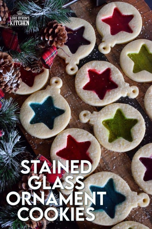 These beautiful Stained Glass Ornament Cookies are made with an easy rolled cookie dough, some glistening sanding sugar, and your favourite flavour of crushed Jolly Ranchers candy. #stainedglass #christmas #holiday #baking #cookies #edible #ornaments #cookiecutters