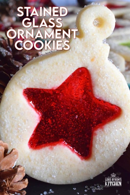 These beautiful Stained Glass Ornament Cookies are made with an easy rolled cookie dough, some glistening sanding sugar, and your favourite flavour of crushed Jolly Ranchers candy. #stainedglass #christmas #holiday #baking #cookies #edible #ornaments #cookiecutters