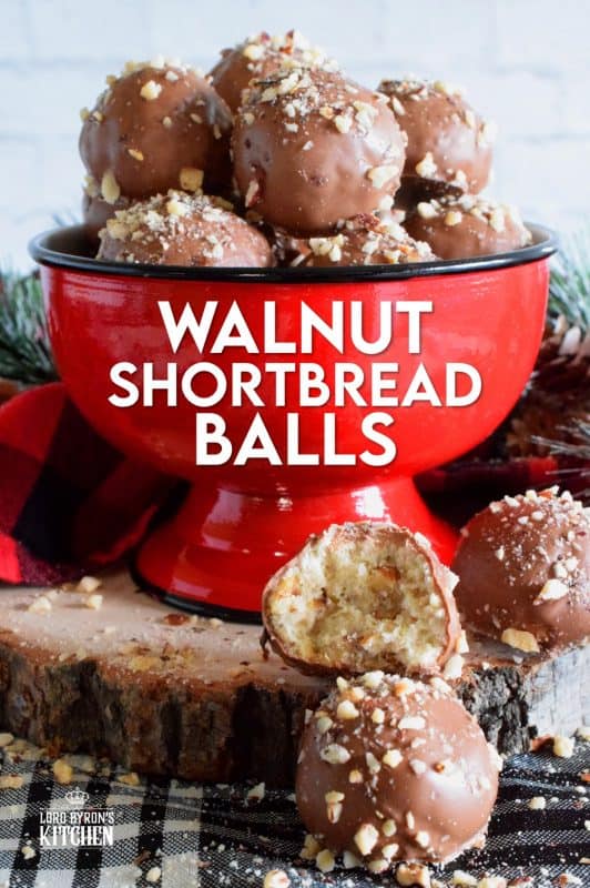 For this cookie, I've taken a shortbread recipe, stuffed it with chopped walnuts, baked them into balls, and dipped them in melted chocolate. Walnut Shortbread Balls are a new take on a Christmas classic! #walnut #shortbread #chocolate #balls #christmas #holiday #baking