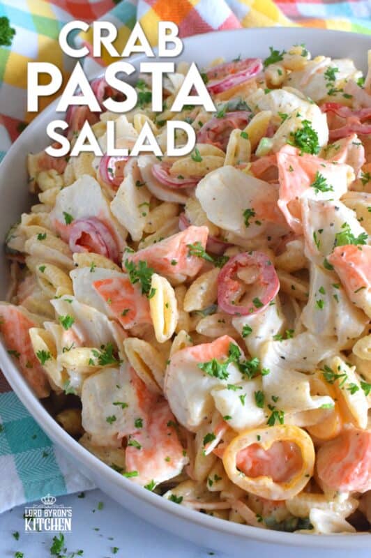 Flaked crab is paired with pasta and peppers in this Crab Pasta Salad. It is tossed in a creamy and tangy dressing made with mayonnaise, old bay seasoning, celery salt, and more. A great make-ahead salad best served slightly chilled with your favourite grilled beef! It's surf and turf - summer style! #crab #pasta #salad #imitation