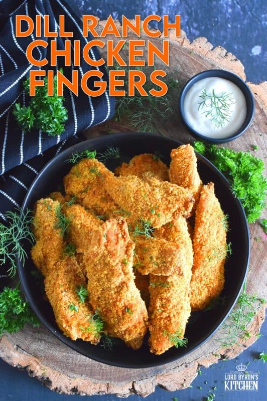 Oven baked until crisp, Dill Ranch Chicken Fingers are first soaked in buttermilk and then breaded in a mixture consisting of crushed corn flakes, chives, parsley, dill, garlic, onion, and a little bit of optional cayenne pepper.  Serve these will a buttermilk dill ranch dressing for the ultimate grown up chicken finger! #dillranch #chickenfingers #chicken #bakednotfried #ovenbaked #recipesformoms #dill