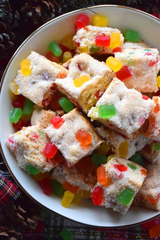 Sometimes a recipe needs to be quick and easy. That's exactly what these Holiday Gumdrop Squares are - and, there's only 4 ingredients in the whole recipe! These are simple to make too, because it's a mix, pour, and bake type of recipe. When fully cooled, cut into squares and enjoy! #condensedmilk #gumdrop #squares #christmas #holiday #baking