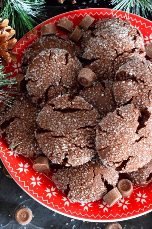 For the ultimate chocolate lover, these Rolo Stuffed Cookies are prepared with a rich chocolaty and fudgy base, which is wrapped around a single Rolo candy. When you bite into one of the cookies, milk chocolate and caramel oozes out - sounds indulgent, right? Perfect for Christmastime, when calories don't count! #christmas #holiday #baking #cookies #rolo #stuffedcookies #caramel #chocolate