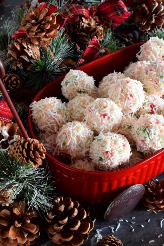 This truffle is a sweet combination of coconut, red and green candied cherries, and sweetened condensed milk. Cherry Snowball Truffles are just slightly soft and gooey. These are not only extremely festive, but super easy to make and freezer-friendly too! #truffles #christmas #holiday #nobake #cherry #redandgreen #candied #cherries #coconut