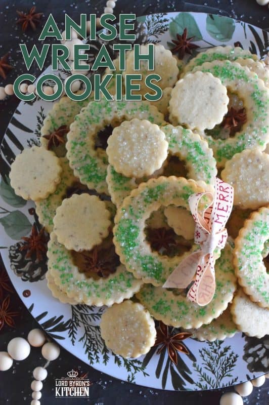 These tender, flaky, yet crisp Anise Wreath Cookies are prepared with a basic rolled cookie dough, but flavoured with crushed anise seeds. Sprinkled with green sanding sugar, these licorice-flavoured cookies are a great addition to any holiday cookie exchange or cookie platter! #christmas #holiday #baking #cookies #wreath #anise