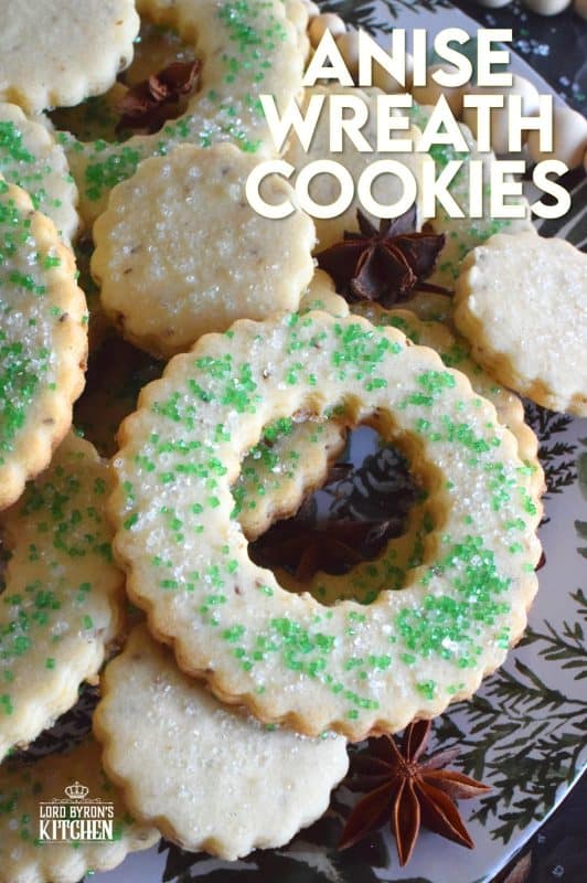 These tender, flaky, yet crisp Anise Wreath Cookies are prepared with a basic rolled cookie dough, but flavoured with crushed anise seeds. Sprinkled with green sanding sugar, these licorice-flavoured cookies are a great addition to any holiday cookie exchange or cookie platter! #christmas #holiday #baking #cookies #wreath #anise