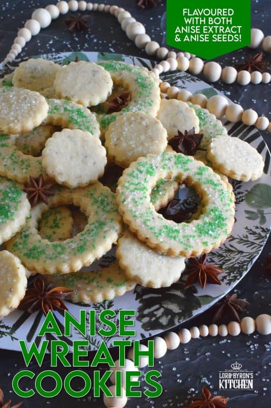 These tender, flaky, yet crisp Anise Wreath Cookies are prepared with a basic rolled cookie dough, but flavoured with crushed anise seeds. Sprinkled with green sanding sugar, these licorice-flavoured cookies are a great addition to any holiday cookie exchange or cookie platter! #christmas #holiday #baking #cookies #wreath #anise