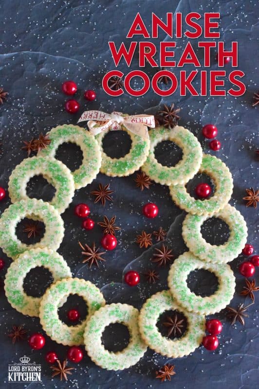 These tender, flaky, yet crisp Anise Wreath Cookies are prepared with a basic rolled cookie dough, but flavoured with crushed anise seeds. Sprinkled with green sanding sugar, these licorice-flavoured cookies are a great addition to any holiday cookie exchange or cookie platter! #christmas #holiday #baking #cookies #wreath #anise