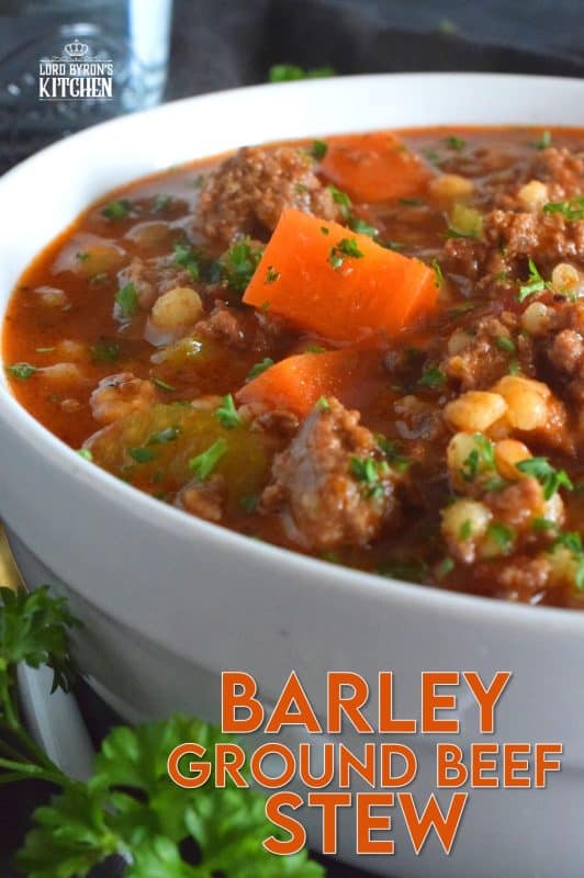 Traditionally, beef stew is made with chuck and can be pricey for the budget-conscious family. Using inexpensive ground beef is a great solution. It's readily available and affordable too. Paired with barley and a few vegetables, this stew is simply delicious! #beef #groundbeef #barley #stew #beefstew