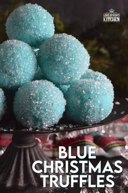 Blue Christmas Truffles are prepared with a white chocolate ganache base. The beautiful colour comes from the addition of blue curacao, which creates a warming sensation as these melt in your mouth. White chocolate and a hint of citrus is what you get with these treats! #bluechristmas #truffles #nobake #ganache #whitechocolate #curacao