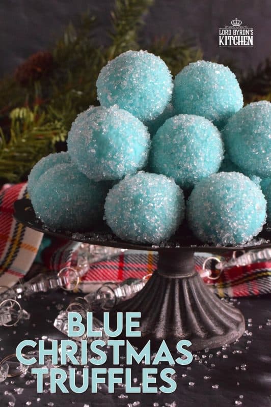 Blue Christmas Truffles are prepared with a white chocolate ganache base. The beautiful colour comes from the addition of blue curacao, which creates a warming sensation as these melt in your mouth. White chocolate and a hint of citrus is what you get with these treats! #bluechristmas #truffles #nobake #ganache #whitechocolate #curacao