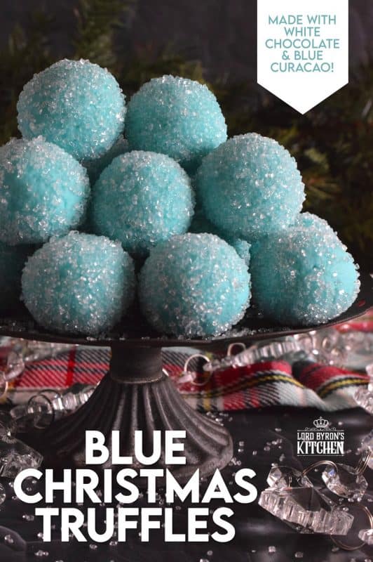 Blue Christmas Truffles are prepared with a white chocolate ganache base. The beautiful colour comes from the addition of blue curacao, which creates a warming sensation as these melt in your mouth. White chocolate and a hint of citrus is what you get with these treats! #bluechristmas #truffles #nobake #ganache #whitechocolate #curacao
