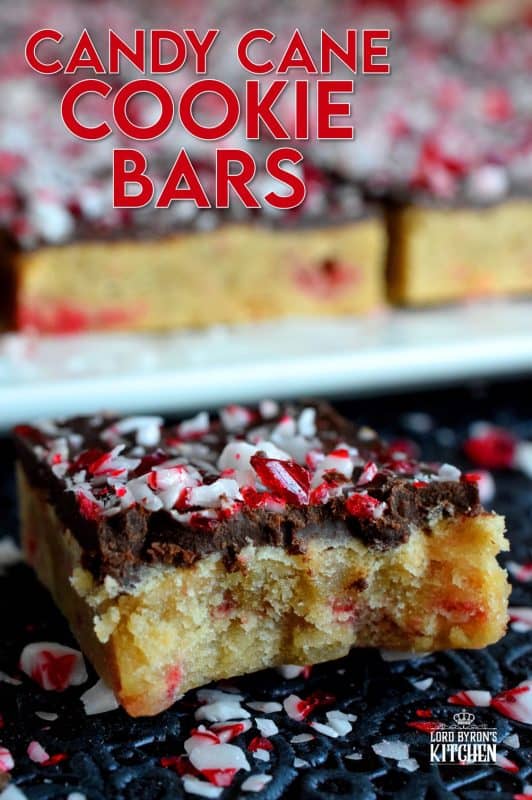 Soft and moist Candy Cane Cookie Bars, which are baked in a sheet pan, then smeared with melted chocolate, and topped with more crushed candy canes, is bound to be a new holiday favourite! These make holiday baking fun and easy! #candycane #cookies #cookiebars #christmas #holiday #baking