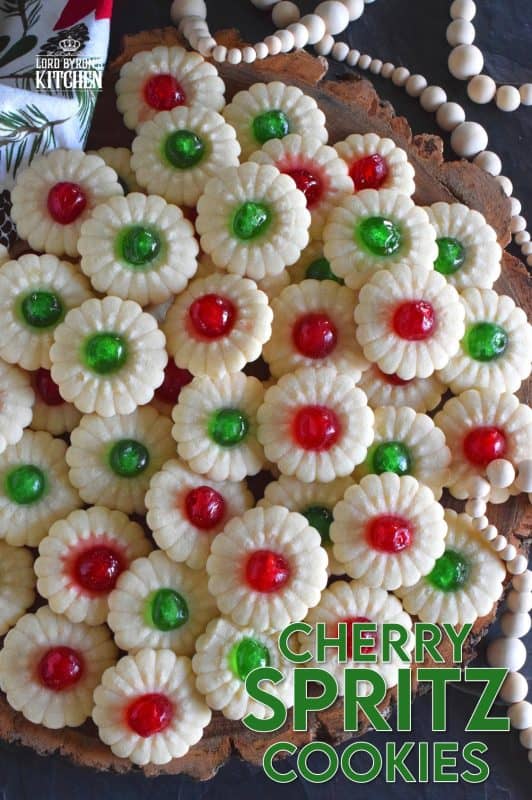 A good spritz cookie should taste slightly sweet and buttery. The cookie should be slightly crumbly, but not dry, and it should melt on your tongue. Nothing is more Christmassy than Cherry Spritz Cookies! It's a long-standing holiday favourite and this one screams cheerful with those brightly coloured candied cherries! #candiedcherries #spritz #spritzcookies #baking #christmas #holiday #redandgreen