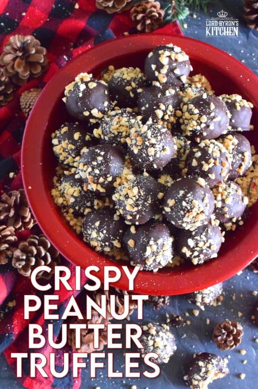 Dipped in melted milk chocolate and topped with chopped, salted peanuts, Crispy Peanut Butter Truffles are a delicious confection that not only melts in your mouth, but the inside has an airy and crispy bite from the Rice Krispies Cereal, peanuts, and chocolate chips. This truffle is for the serious peanut butter and chocolate lover! #christmas #holiday #nobake #truffles #peanutbutter #chocolate #ricekrispies