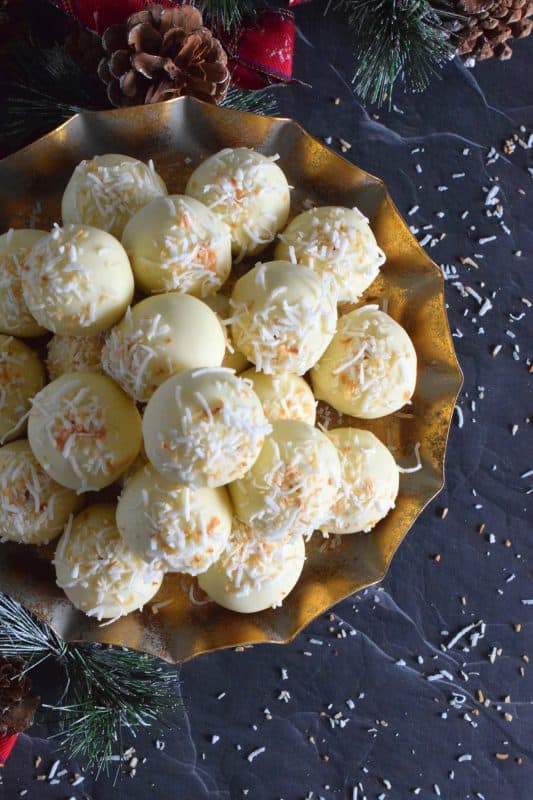 You will not believe how easy these Coconut Shortbread Truffles are to prepare! With lots of coconut flavour, these truffles are made with crumbled shortbread cookies and dipped in velvety white chocolate. Be sure to toast the coconut first to really get the best out of this holiday confection! #holiday #christmas #chocolate #truffles #coconut #nobake #cookies