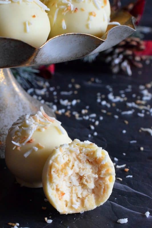 You will not believe how easy these Coconut Shortbread Truffles are to prepare! With lots of coconut flavour, these truffles are made with crumbled shortbread cookies and dipped in velvety white chocolate. Be sure to toast the coconut first to really get the best out of this holiday confection! #holiday #christmas #chocolate #truffles #coconut #nobake #cookies
